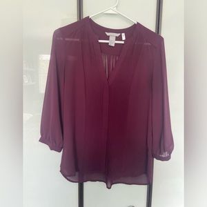 Burgundy clothes with pleats in front